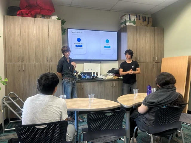 TimeBack facilitators talking with students in the Redwood City Library Teen Center.