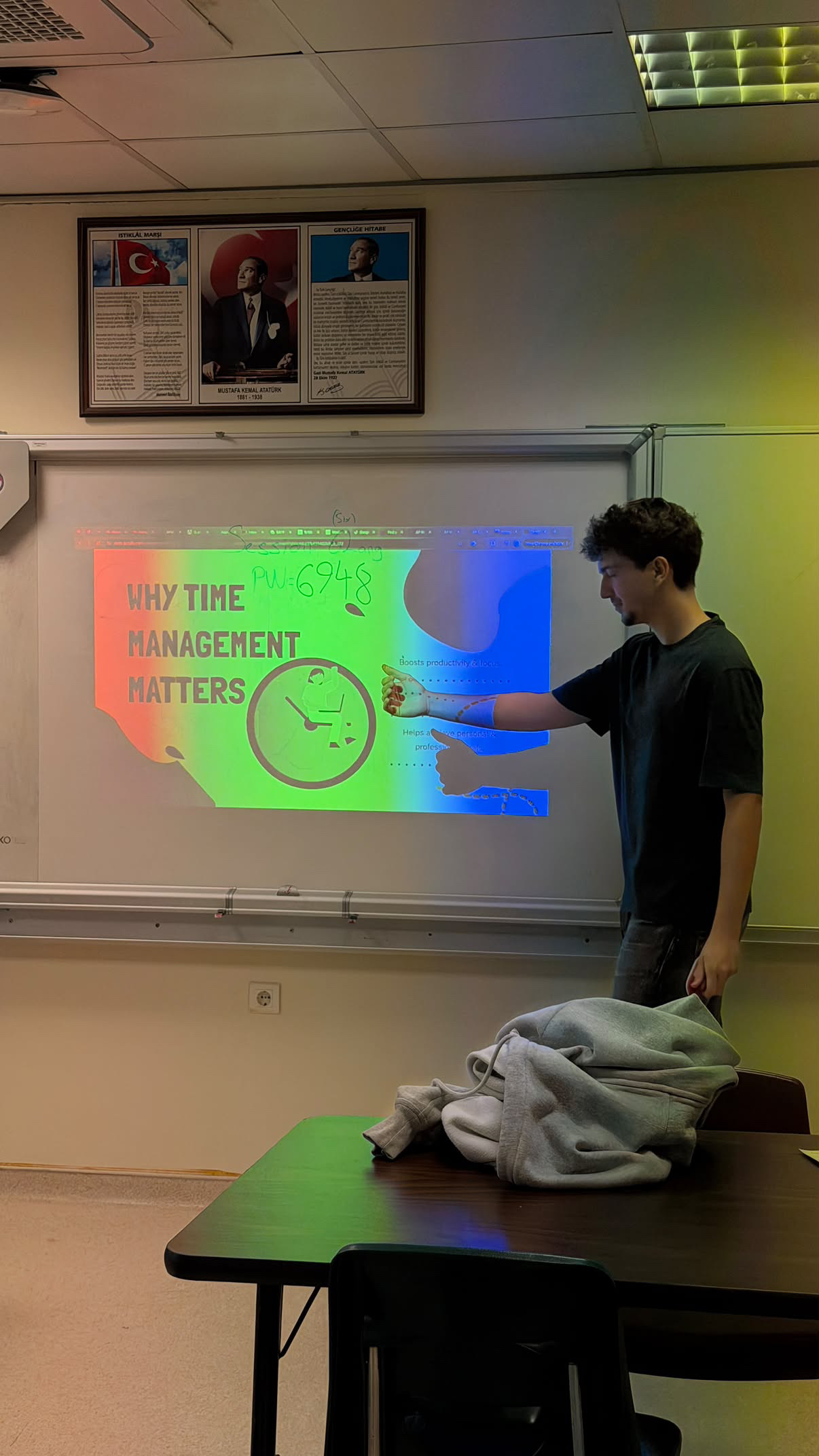 A presenter pointing to the lesson during the meeting.